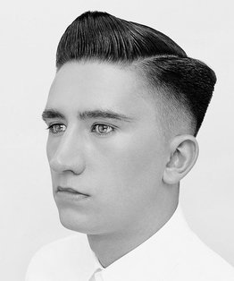 Graduated scissor and clipper-over-comb on a parting haircut